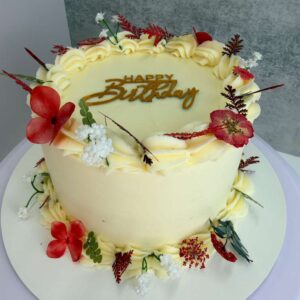 Elegant Floral Birthday Cake with Gold Topper